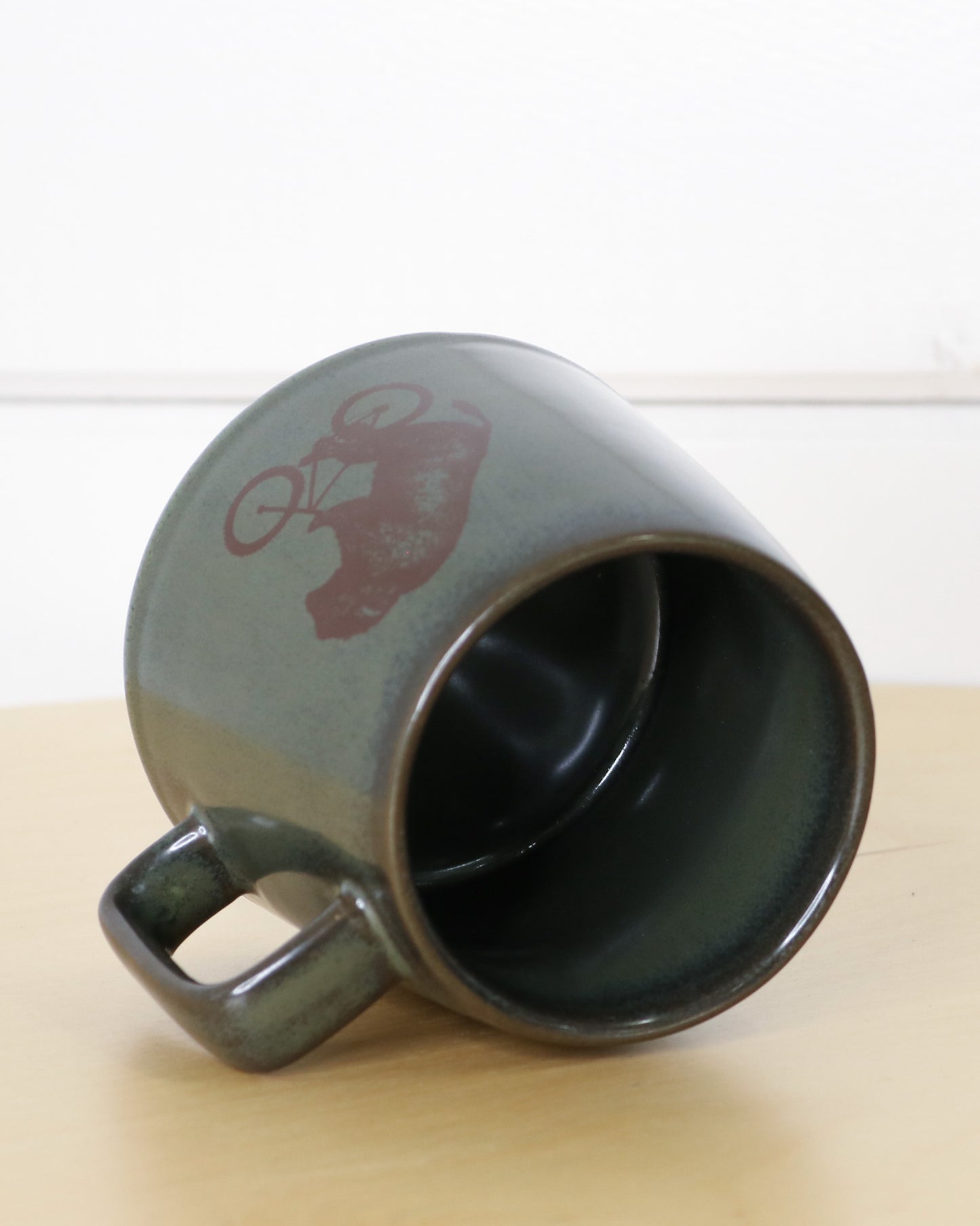Earthy Green Ceramic Mug With Handle and Biking Bison Logo, Side