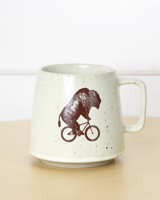Brown Speckled White Ceramic Mug With Handle and Biking Bison Logo, Front